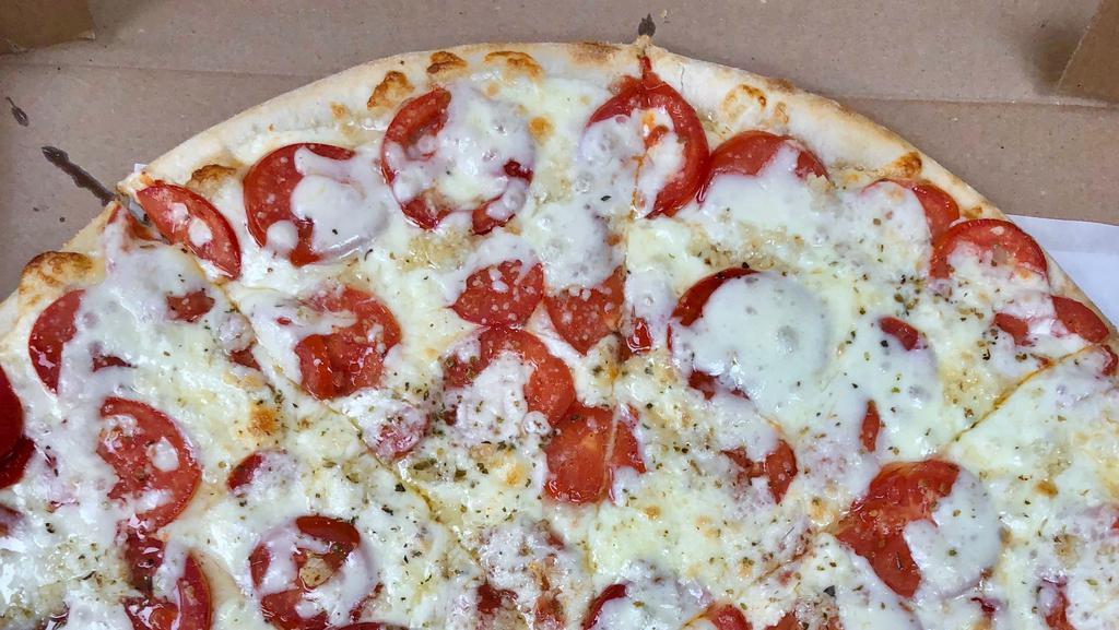 Tomato & Garlic Pizza · Fresh sliced tomatoes, mozzarella, touch of garlic and oregano, grated cheese. No sauce.