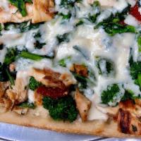 Broccoli Rabe Pizza · Broccoli rabe, sundried tomatoes and Grilled chicken topped with mozzarella on a square thin...