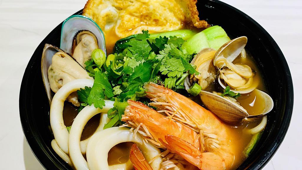 Seafood Ramen Noodle Soup · Shrimp, squid, mussel, and blood clam all in one lanzhou style ramen, served with a fried egg.