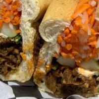 Beef Sandwich · Mayonnaise, butter, cucumber, julienne carrots, daikon radish, and cilantro. Served on a toa...