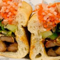 Grilled Chicken Sandwich · Mayonnaise, butter, cucumber, julienne carrots, daikon radish, and cilantro. Served on a toa...
