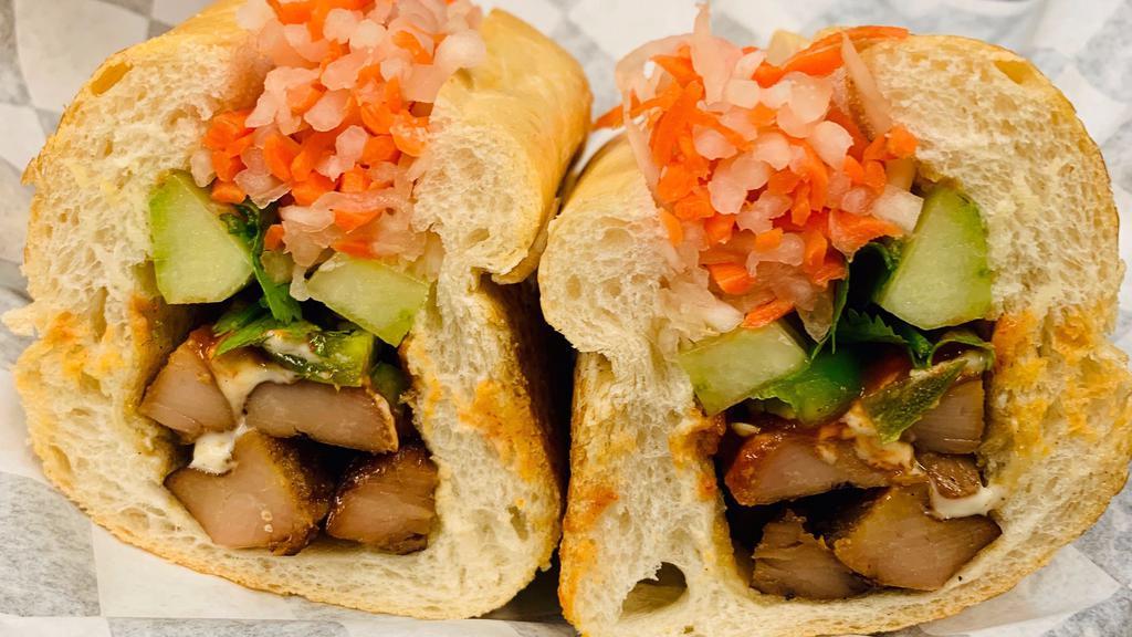Grilled Chicken Sandwich · Mayonnaise, butter, cucumber, julienne carrots, daikon radish, and cilantro. Served on a toasted french baguette.