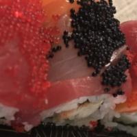 Rainbow Roll · Kani, avocado and cucumber w. assorted sashimi