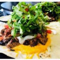 The Steak Fiesta · Sirloin steak, cheddar cheese, grilled onions, lettuce, tomatoes, sour cream, guacamole and ...