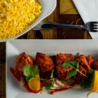 Chicken Tikka · Skinless breast of chicken, deboned and marinated in the mildly spiced marinade. Served with...