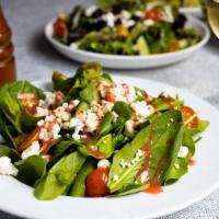 Spinach Salad · Bed of baby spinach with selected toppings.