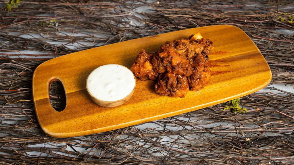Bbq In The Air · Wings cooked and tossed in classic BBQ Sauce. Served with Ranch Sauce.
