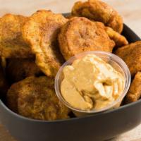 Fried Plantains · cajun-seasoned plantain chips served w/ smokehouse aioli. vegan. gf (but fried in same oil a...