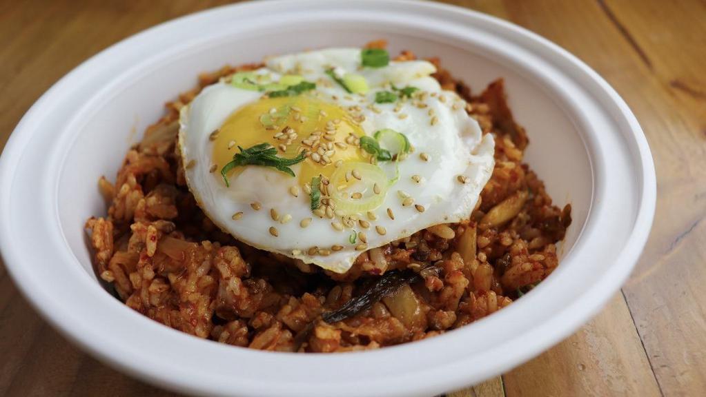 Wagyu Kimchi Fried Rice · Fried rice with kimchi and ground wagyu beef topped with sunny side up egg. Gluten-free.