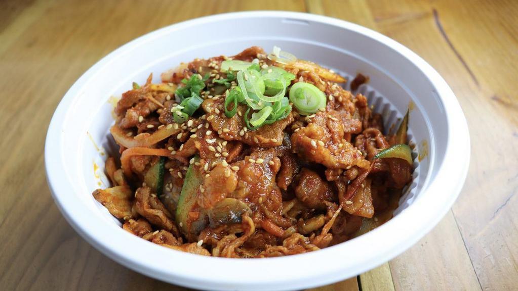 Jeh-Yuk Over Rice · Stir-fried pork and vegetables in gochujang sauce.