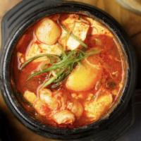 Seafood Sundubu Jjigae · Silken tofu stew made with calamari, shrimp, baby clam. Gluten-free.