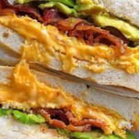 Bacon Egg And Cheese W/ Avocado
 · 3 slices of High Quality Crispy Bacon, Fried Eggs and American Cheese on a Roll. Type SPK in...