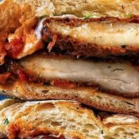 The Mambo Sandwich · Chicken parmesan, fresh mozzarella, and freshly shaved parmesan on a toasted garlic butter r...