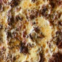 Pulled Pork And Smoked Gouda Pizza · Our pulled pork with melted cheddar and smoked gouda sauce