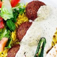  Falafel Platter · Served with yellow basmati rice with a special mixture of our spices fresh salad of tomatoes...