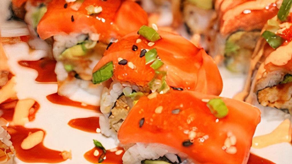Fire Dragon Roll · Shrimp tempura, avocado topped with salmon, and special spicy sauce.