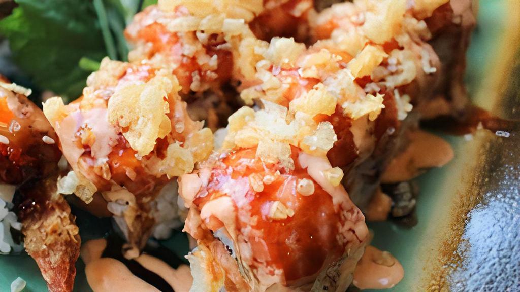 Fire Fight Roll · Spicy tuna, crab, cucumber, topped with spicy tuna, crunch, sweet sauce, and spicy mayonnaise.