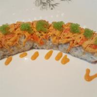 Triple Crown Roll · Inside: Spicy grilled yellowtail, scallion, and cucumber. Top: Tuna and salmon with ginger s...