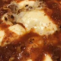 Train Wreck Lasagna · Fresh handmade pasta, beef ragu, crumbled fennel sausage, ricotta, mozzarella (open face las...
