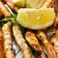 Grilled Shrimp Skewers Tapas · With sea salt and lemon.