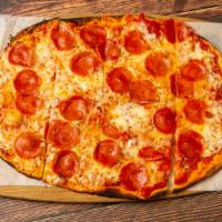 Pizza Calabrese · Hand cut pepperoni rounds, fresh mozzarella, rustic tomato sauce, red pepper sauce.