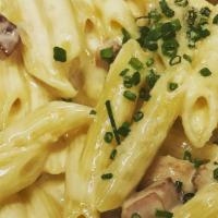 Penne Carbonara · Sauteed pancetta, fresh black pepper, egg, parmesan and a touch of cream like in roma.