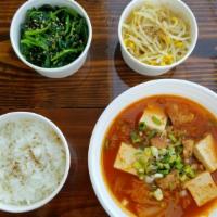 Kimchi Jjigae (Stew) Meal · Spicy Korean Stew made with kimchi, pork, tofu, onion, and scallion. Served with a bowl of w...