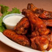 Chicken Wings · Jumbo chicken wings served with celery and blue cheese and tossed in your choice of sauce – ...