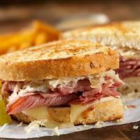 The Reuben · Thuman’s corned beef with swiss cheese, sauerkraut and Russian dressing on grilled rye.