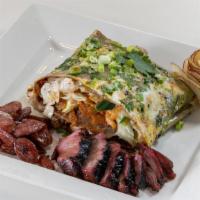 1 Meat Choice Jian Bing · The OG. Jian Bing is a traditional Chinese savory crepe with egg, green onions, cilantro, bl...