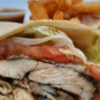 Jerk Chicken Wrap & Fries  · A grilled tortilla loaded with sliced jerk chicken breast, fresh lettuce, tomatoes, and our ...