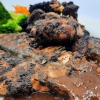 Jerk Chicken & Salmon  · Served with your choice of rasta pasta, rice and peas, mixed vegetables, and mashed potatoes...