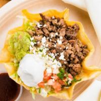 Taco Salad · Crispy flour tortilla shell filled with beans, lettuce, pico de gallo, guacamole, and sour c...