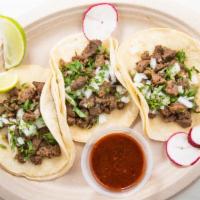 Street Taco · Soft corn tortilla stuffed with your choice of shredded beef, shredded chicken, Angus carne ...