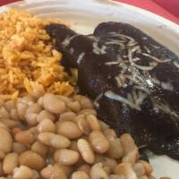 Chicken Mole Enchiladas · Two rolled corn tortillas stuffed with shredded chicken and baked in chef Roberto's homemade...