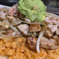 Roberto'S Fish Burrito · 13 in. flour tortilla with our catch of the day, homemade slaw, guacamole, and rice &  beans...