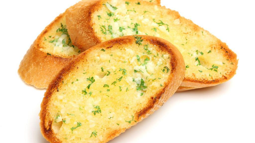 Garlic Bread · Freshly baked bread topped with garlic, olive oil, butter, and herb seasoning baked to perfection.