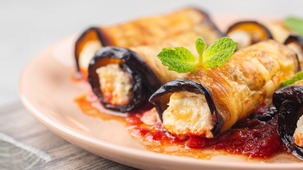 Eggplant Rollatini · Thinly sliced eggplant, fried and rolled up with a ricotta filling.