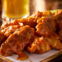 Buffalo Chicken Wings · Deep-fried crispy chicken wings in a fiery buffalo sauce.