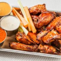 48 Wings · served naked or tossed if you like. Choice of Sauces “Wenzel” Buffalo, Elsie Sauce, BBQ, Swe...