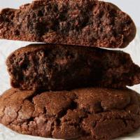 Triple Chocolate Walnut · Triple chocolate chip cookie made with chocolate dough, dark and milk chocolate chips and wa...