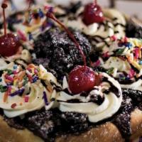 Cookies And Cream · Chocolate cream cookie crumble, chocolate sauce, white chocolate, cherries and homemade whip...