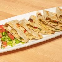 Grilled Steak Quesadillas · Onion, serrano peppers, jack, Mexican spices.