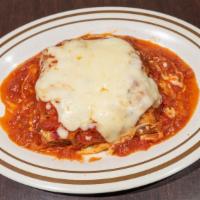 Lasagna · Italian dish made of stacked layers of thin flat pasta alternating with fillings. layered di...