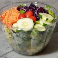 Garden Salad · Romaine lettuce, grape tomatoes, shredded carrots, cucumber, and purple cabbage.