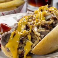 Philly Cheesesteak · served on toasted Hero with cooked onions and green peppers, melted American cheese, lettuce...