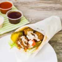 Falafel · Vegetarian. fresh Falafel served on Pita, Salad and your choice of sauce (Try it with Tahini )
