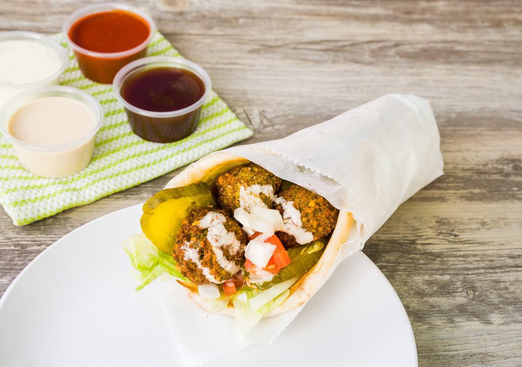 Falafel · Vegetarian. fresh Falafel served on Pita, Salad and your choice of sauce (Try it with Tahini )