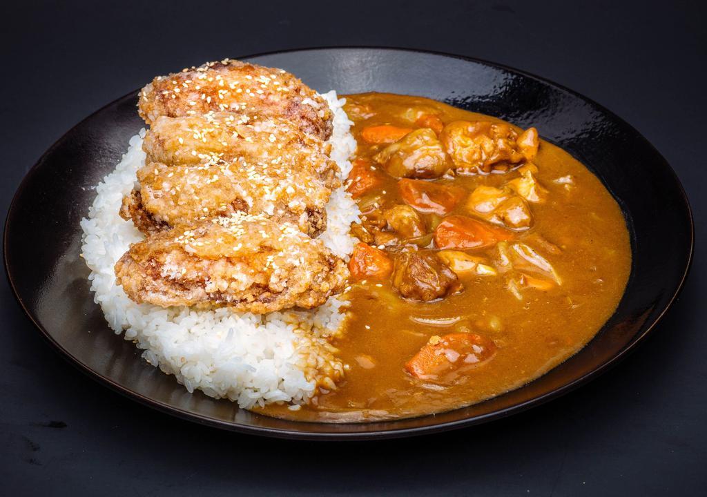  Goma Wing Curry Rice · Served with Hokkaido rice, chicken wings, and red ginger.