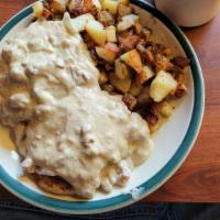 Hillbilly Platter · English muffin topped with sausage patties,eggs,and sausage gravy over all. home fries